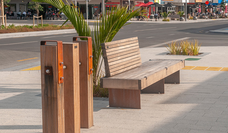 Street furniture uses a palette of Corten steel and Tonka hardwood, both materials used regularly in marine environments