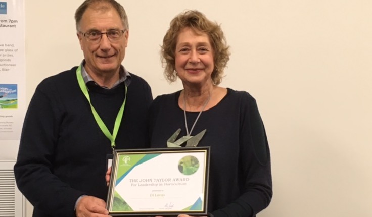Di Lucas being presented the John Taylor Award by Allan Jolliffe