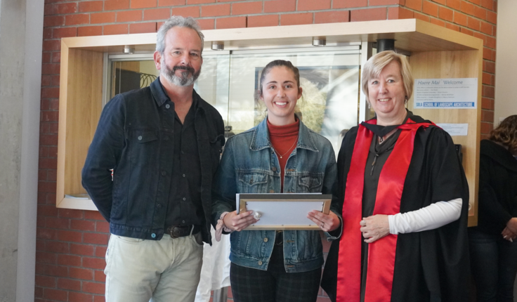Joanna Kent being presented the NZILA Award for Excellence by Matt Lester with Gillian Lawson.