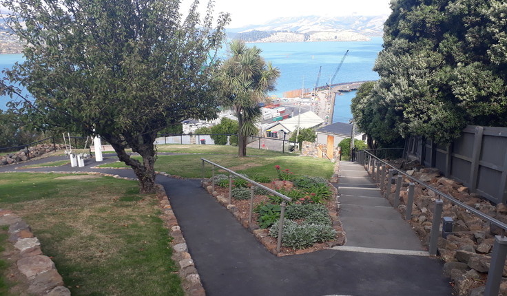 The grounds provide a peaceful vantage point overlooking the harbour.