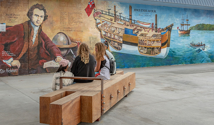 Whitianga Art group member, Peter Nicholson, created this mural on the wall of the Mainly Casual building immediately next to the new Whitianga town plaza in Albert Street. It depicts the Endeavour ship and botanist Joseph Banks (a member of the Endeavour’s crew)