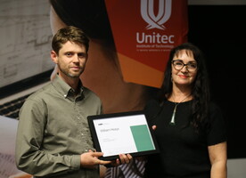 William Heays being presented NZILA/Frank Boffa Award Supreme Award for overall excellence by Debbie Tikao.