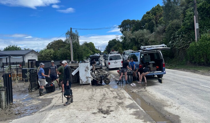 Community in action in the middle of the cyclone damage. Image credit - Shannon Bray.