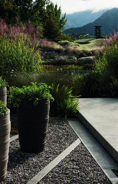 View from the herb garden across the pond, through the tall miscanthus, towards the Chris Booth sculture.