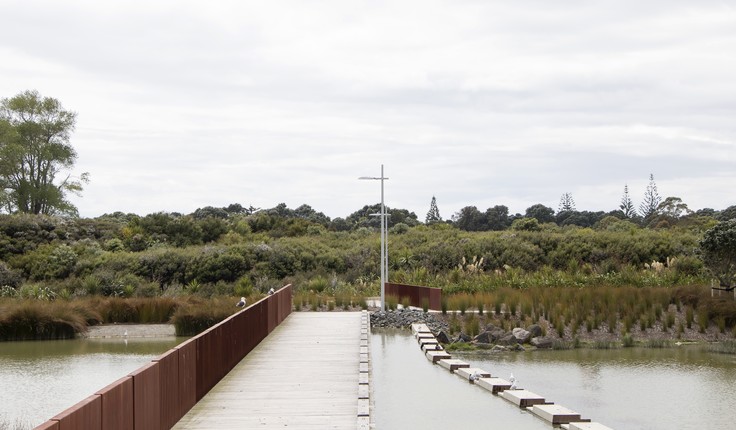 Long Bay, Auckland; the pedestrian bridge network integrates with weir infrastructure. Credit Sam Gould