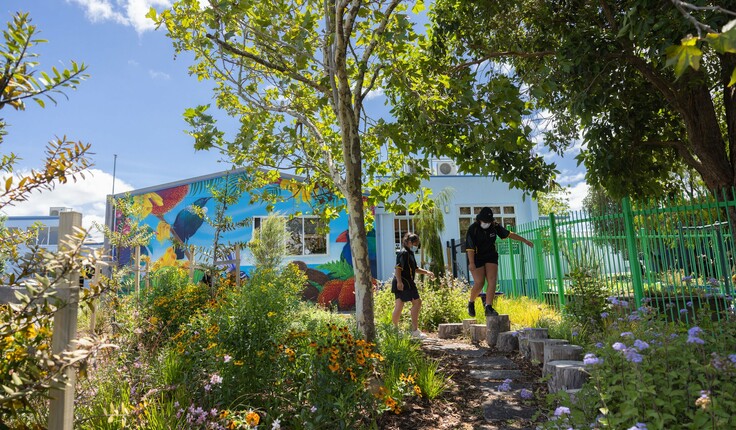 Students play on the recycled tree stumps. Image credit - Scott Sinton.