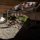Within Te Rua undercroft with net & Totara tree above, Andy Spain Photography (2020)