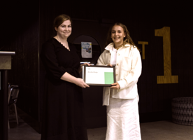 Cassandra Drayton presents Amelia Platje with the NZILA Award of Excellence as the top student in the 3rd to last year for the 2022 academic year.