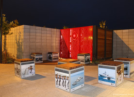Several cube seats clustered near the entrance. Galvanised steel frames with fixed steel panels and timber tops. The NZ Defence Force provided contemporary Navy images which were laminated to the steel panels by the local Horton Signs.